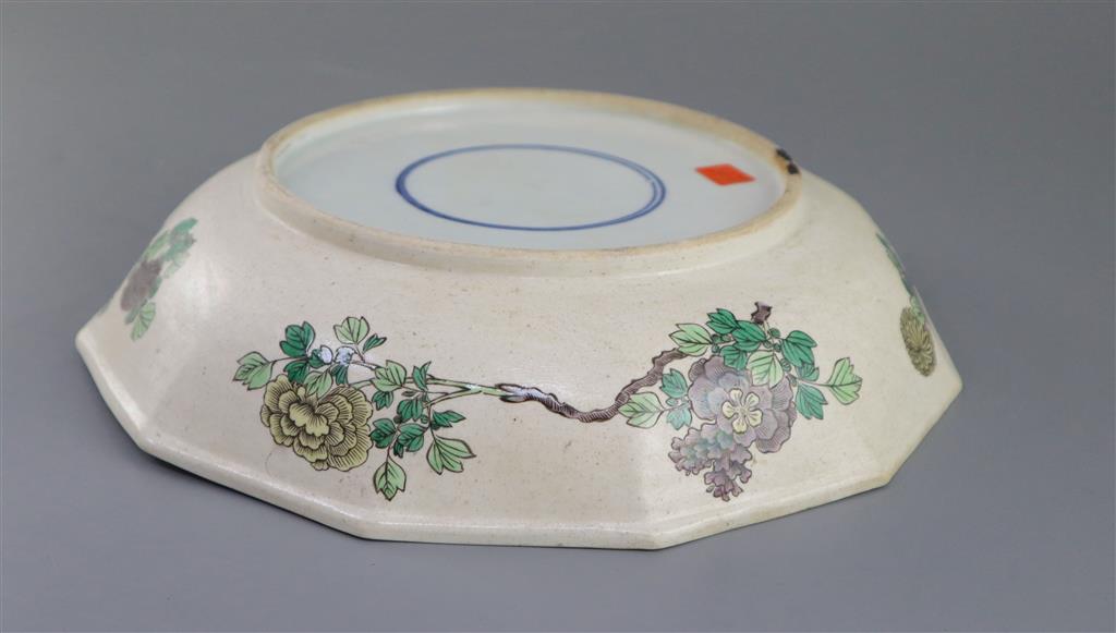 An unusual Chinese famille verte decorated biscuit porcelain twelve sided dish, 19th century in Kangxi style, 26cm wide